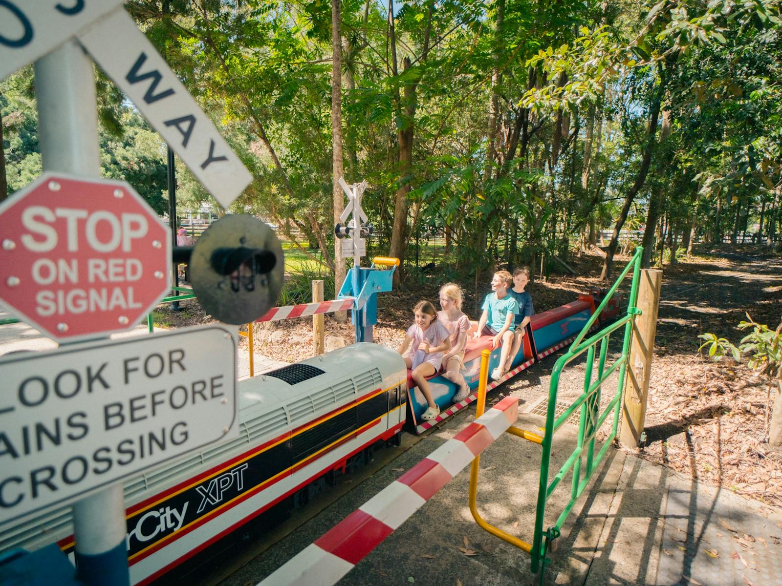 Going through the crossing on the miniature train