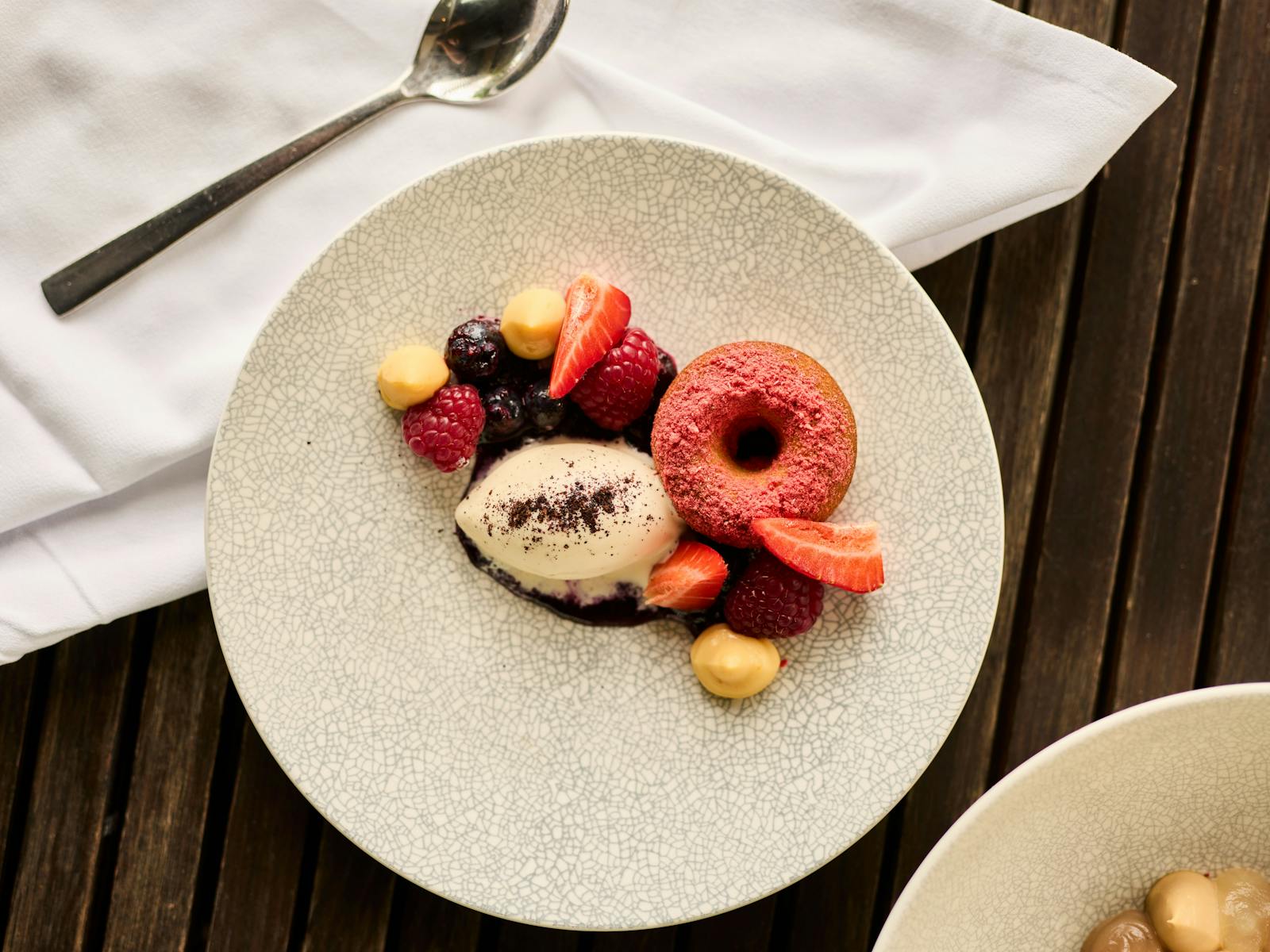 A dessert of berries and cream at Josef Chromy Restaurant