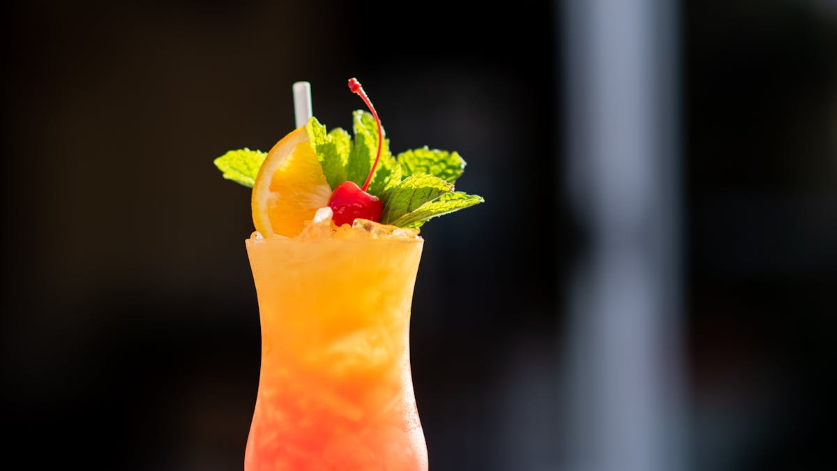 An amazing cocktail with beautiful garnishes