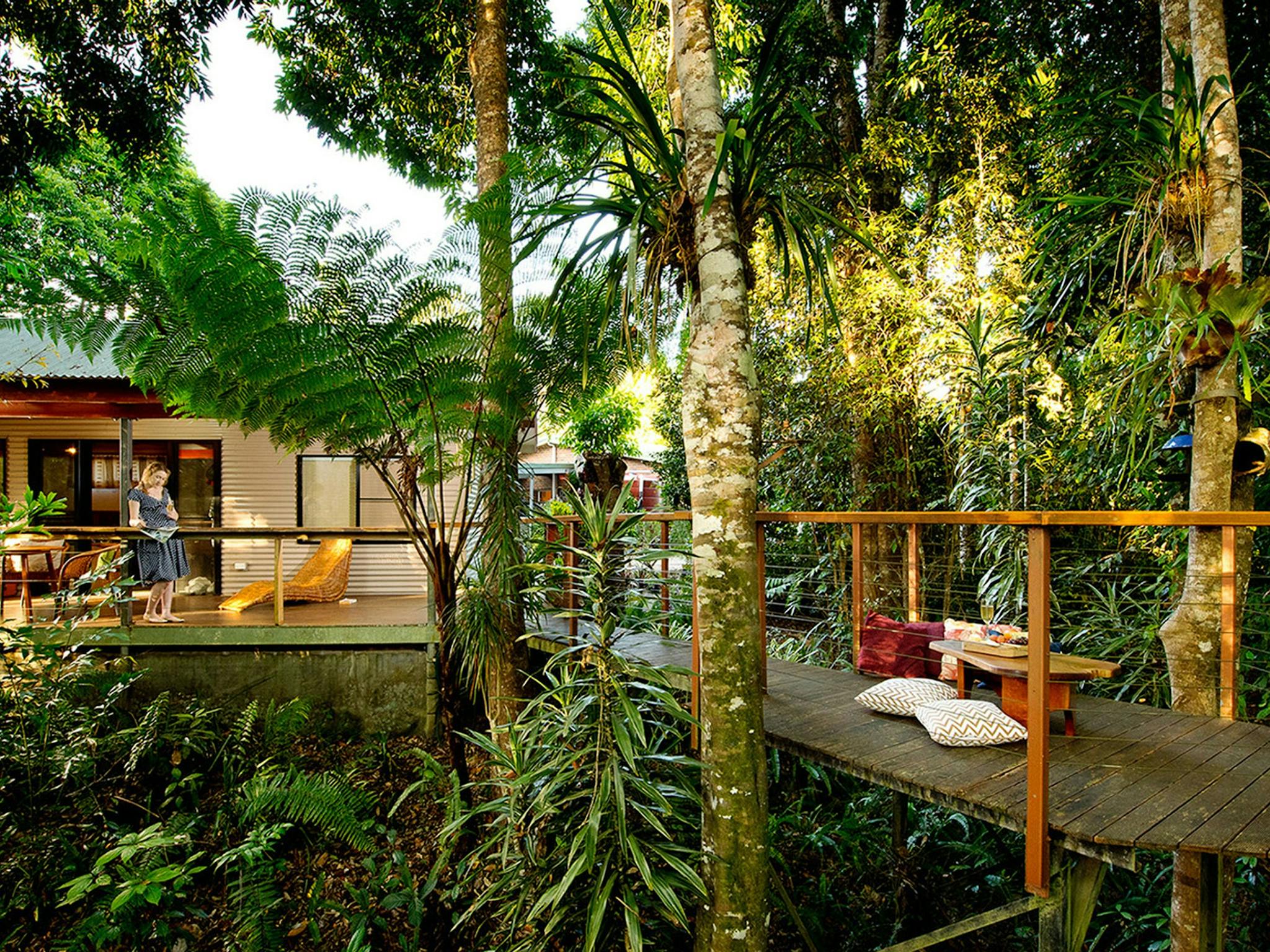 alt="Veranda and walkway leads into the rain forest overlooking the river at Sharlynn" alt="Veranda and walkway leads into the rain forest overlooking the river at Sharlynn"