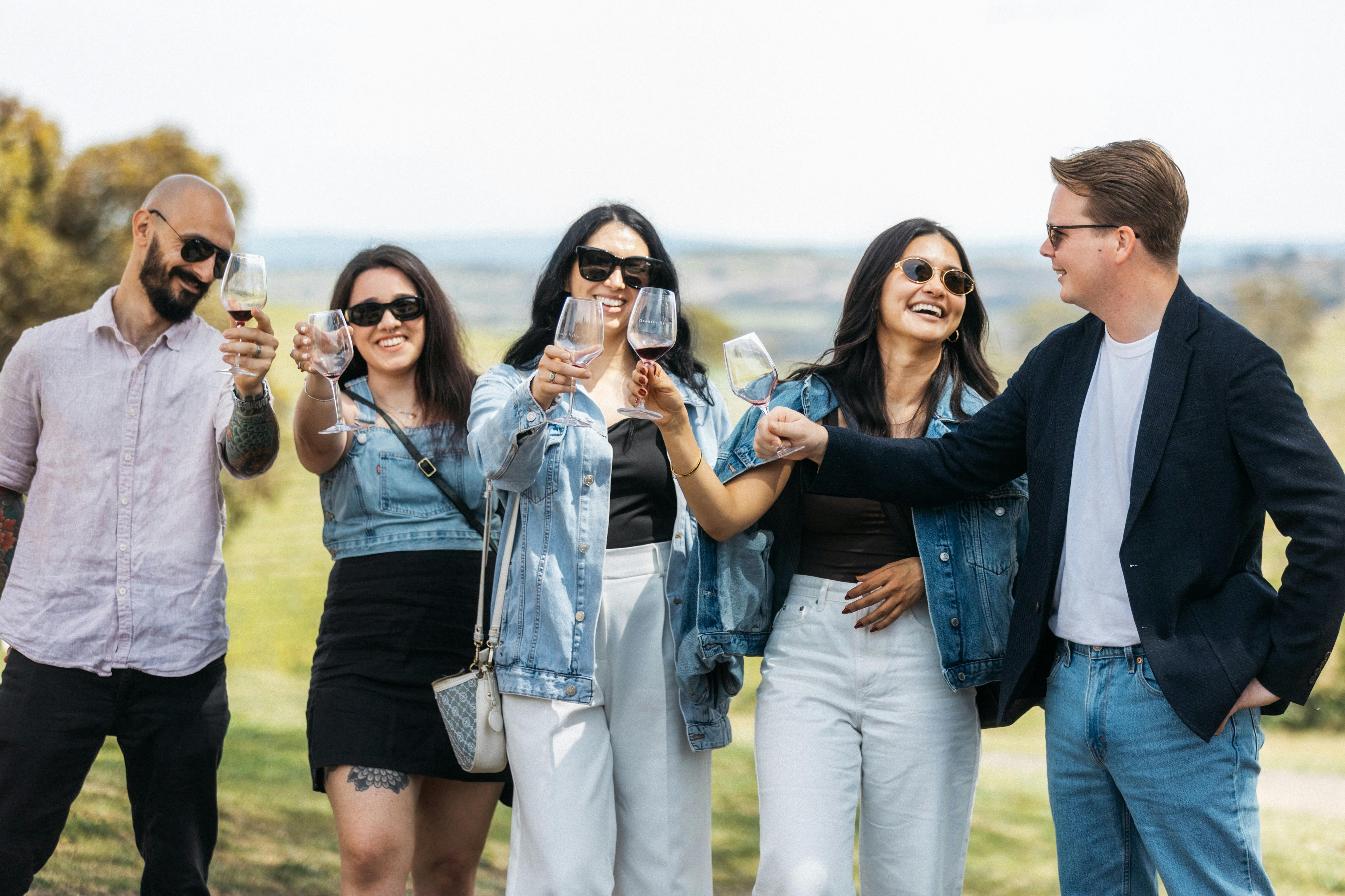 Group cheers with wine glasses