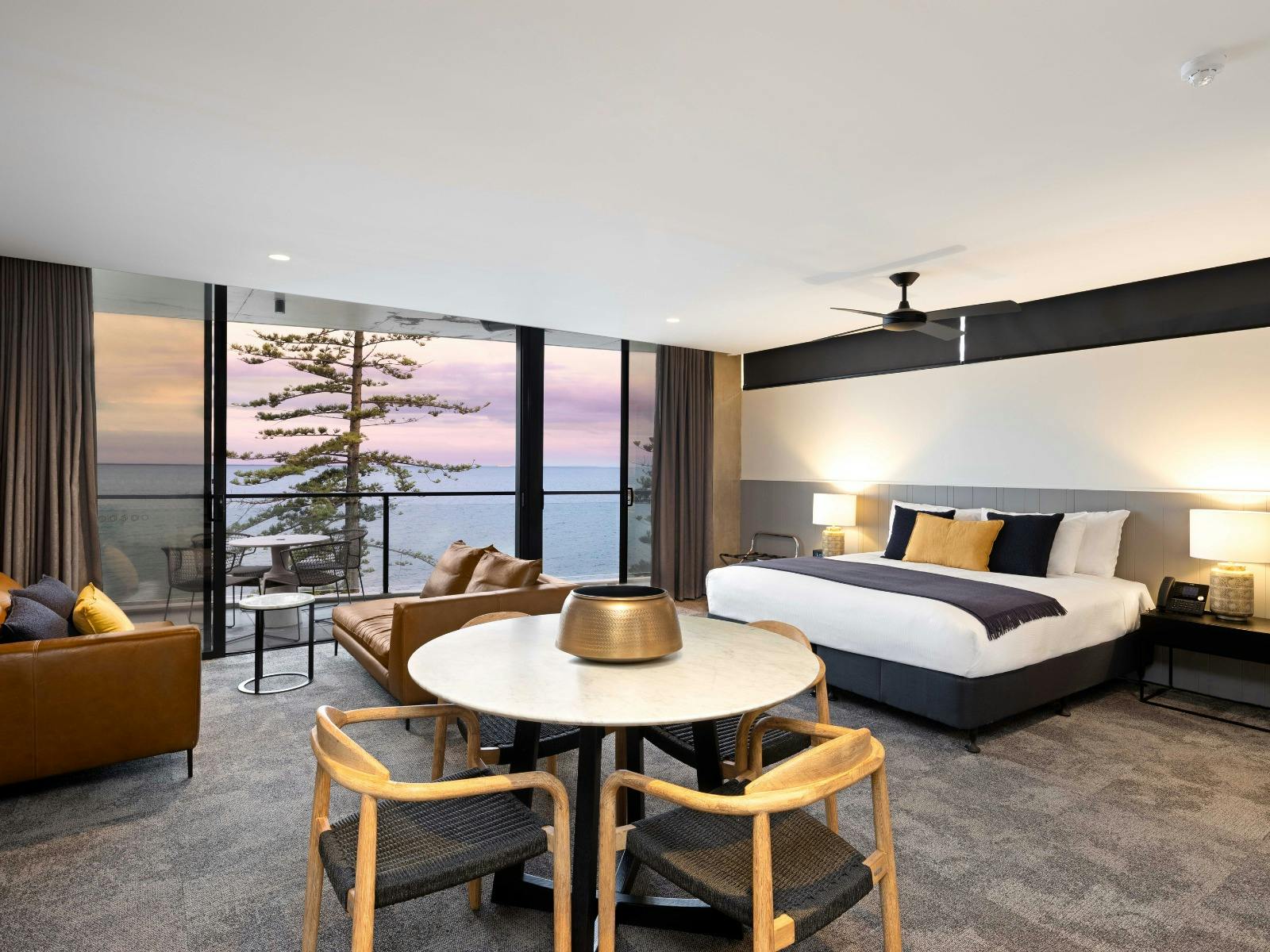 Spacious room with king bed, dining table and balcony Spacious room with king bed, dining table and balcony