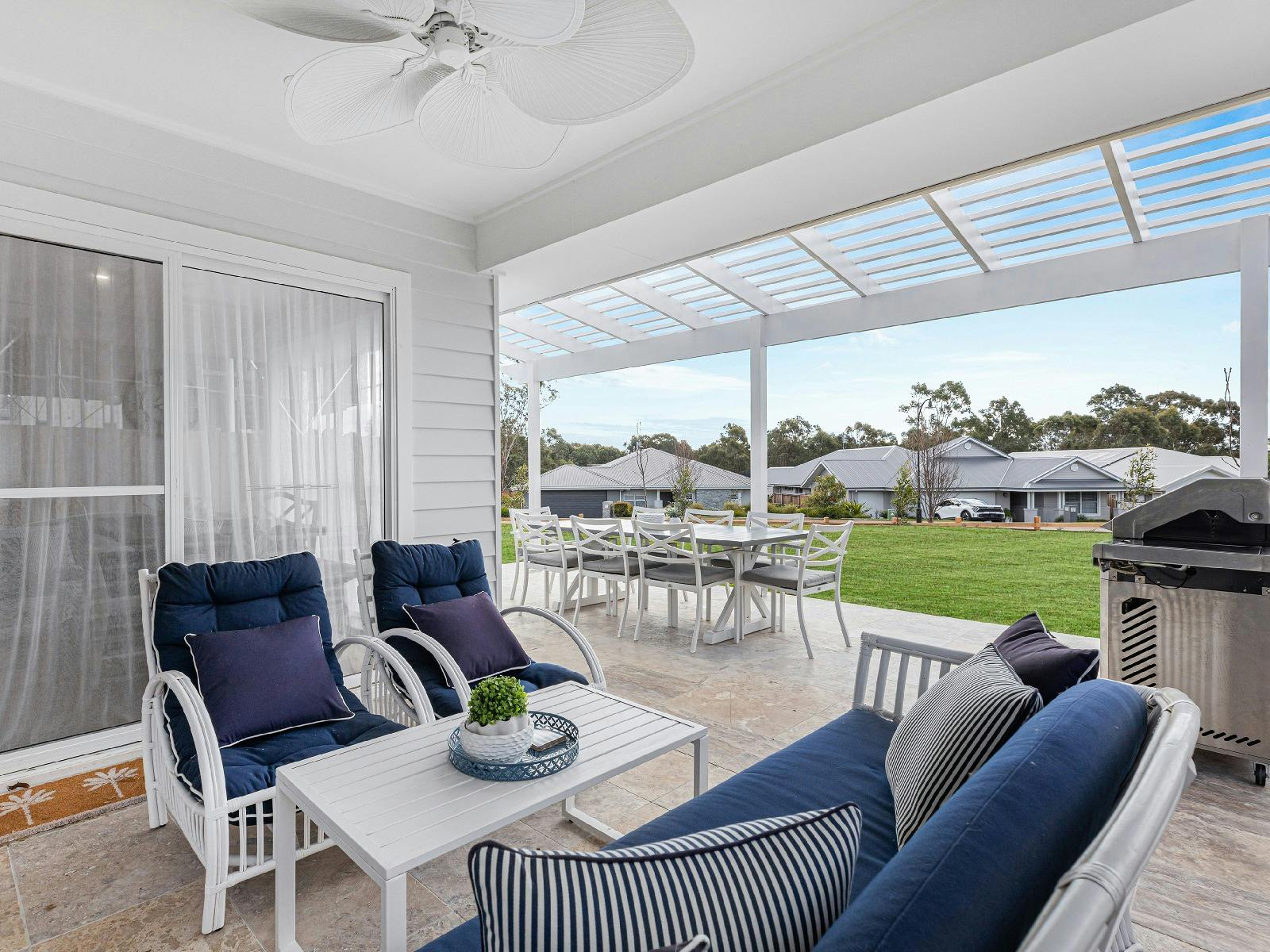 Montauk House outdoor lounge room with BBQ