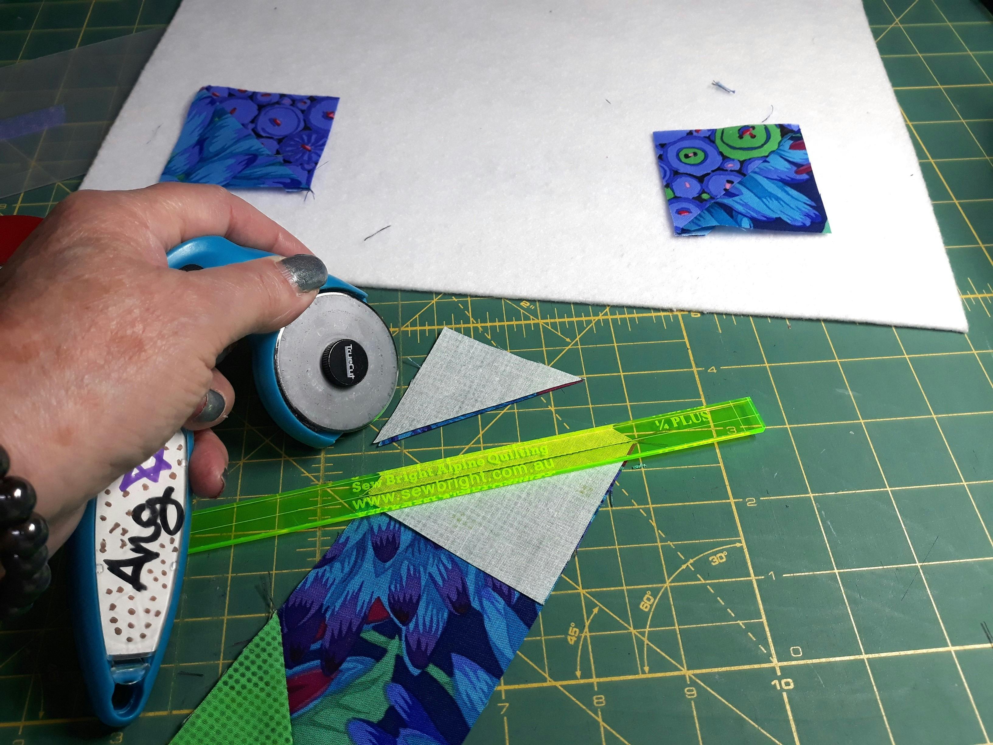 how to use rotary cutter to trim blocks at Sew Bright ALpine Quilting