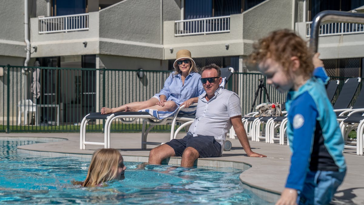 Family enjoying the outdoor pool
