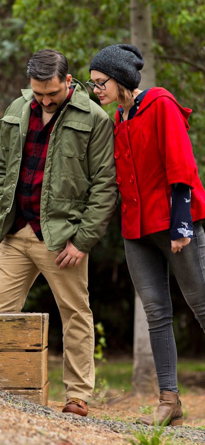 a couplelooking into the entry to an air raid shelter