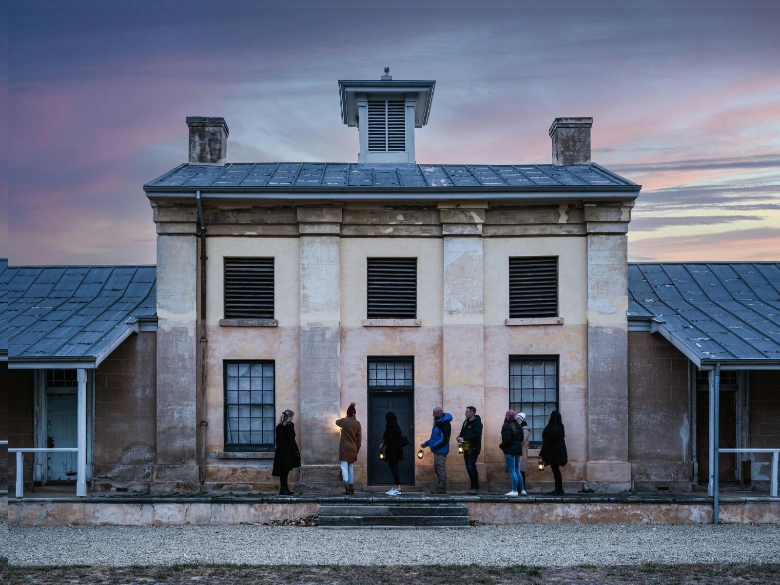 Guests walking in front of the Barracks at Willow Court