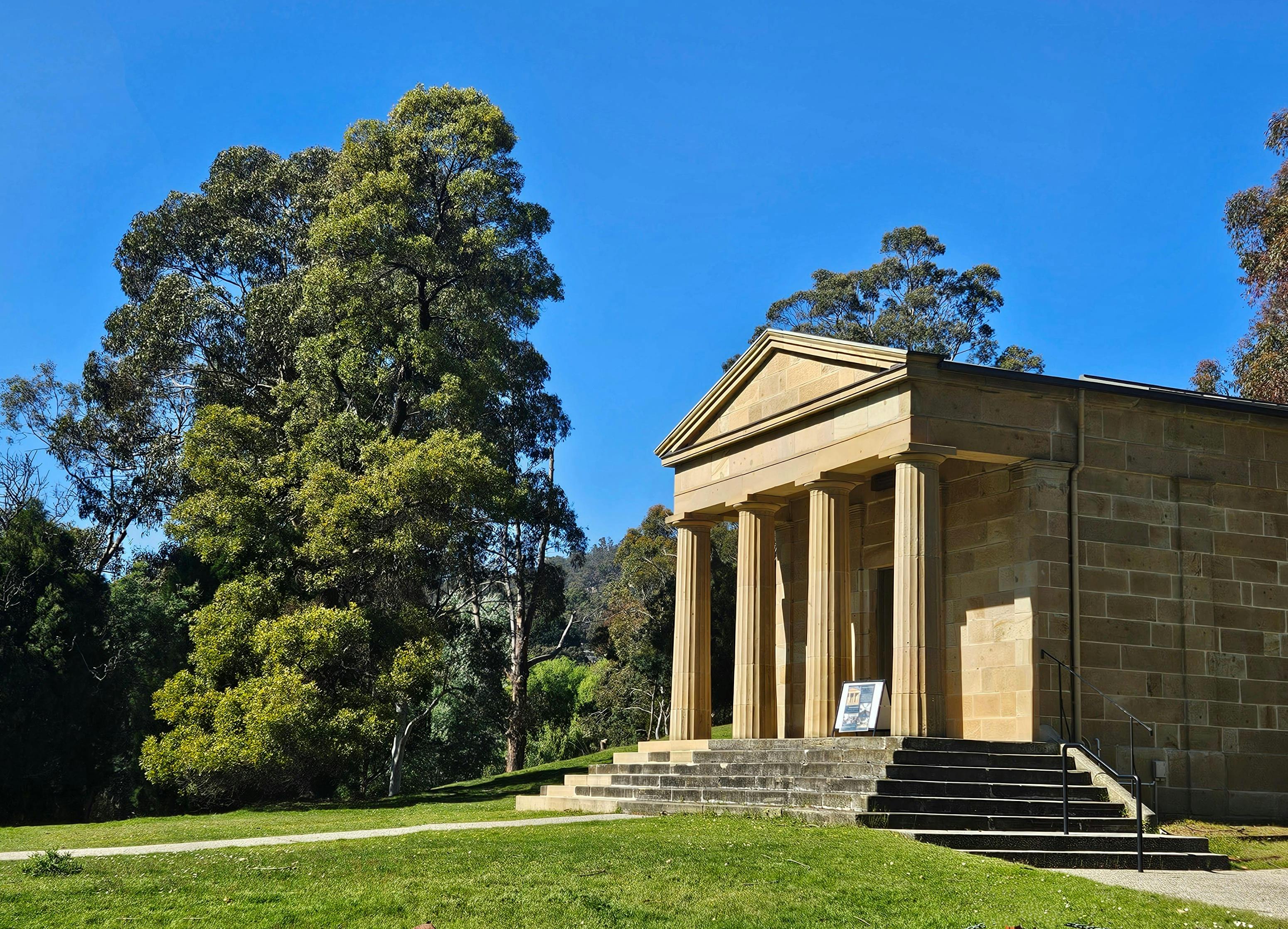 Outside of the columned sandstone gallery set in a park