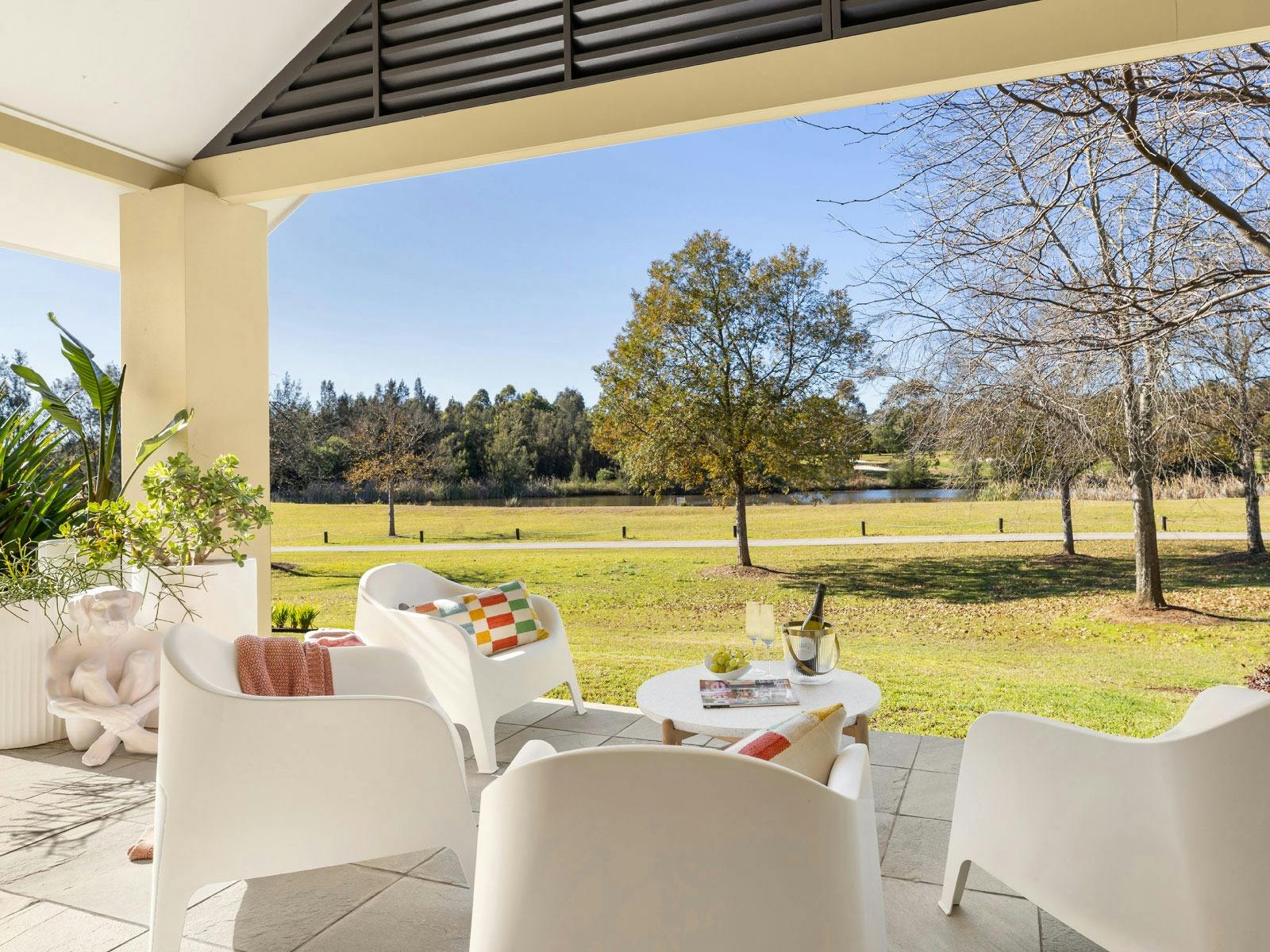The Lake House outdoor seating overlooking parklands and golf course
