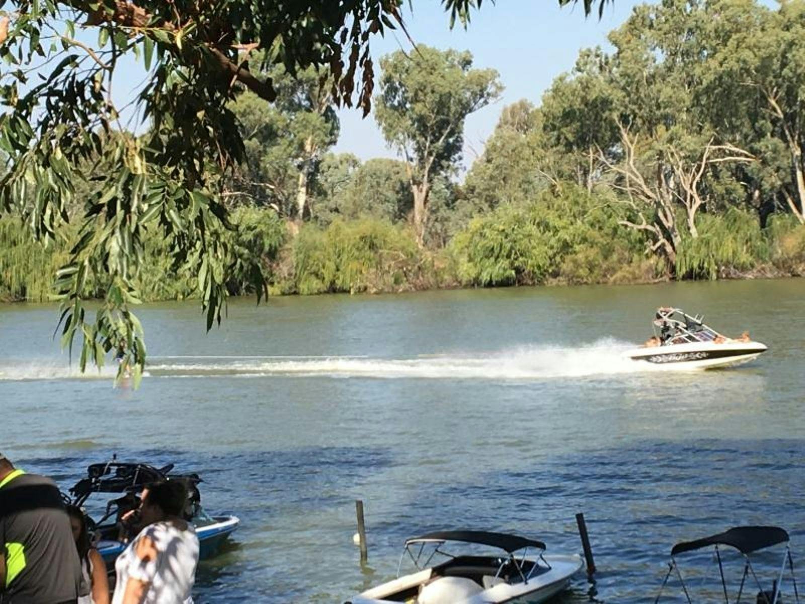 Image of speed boats on the river