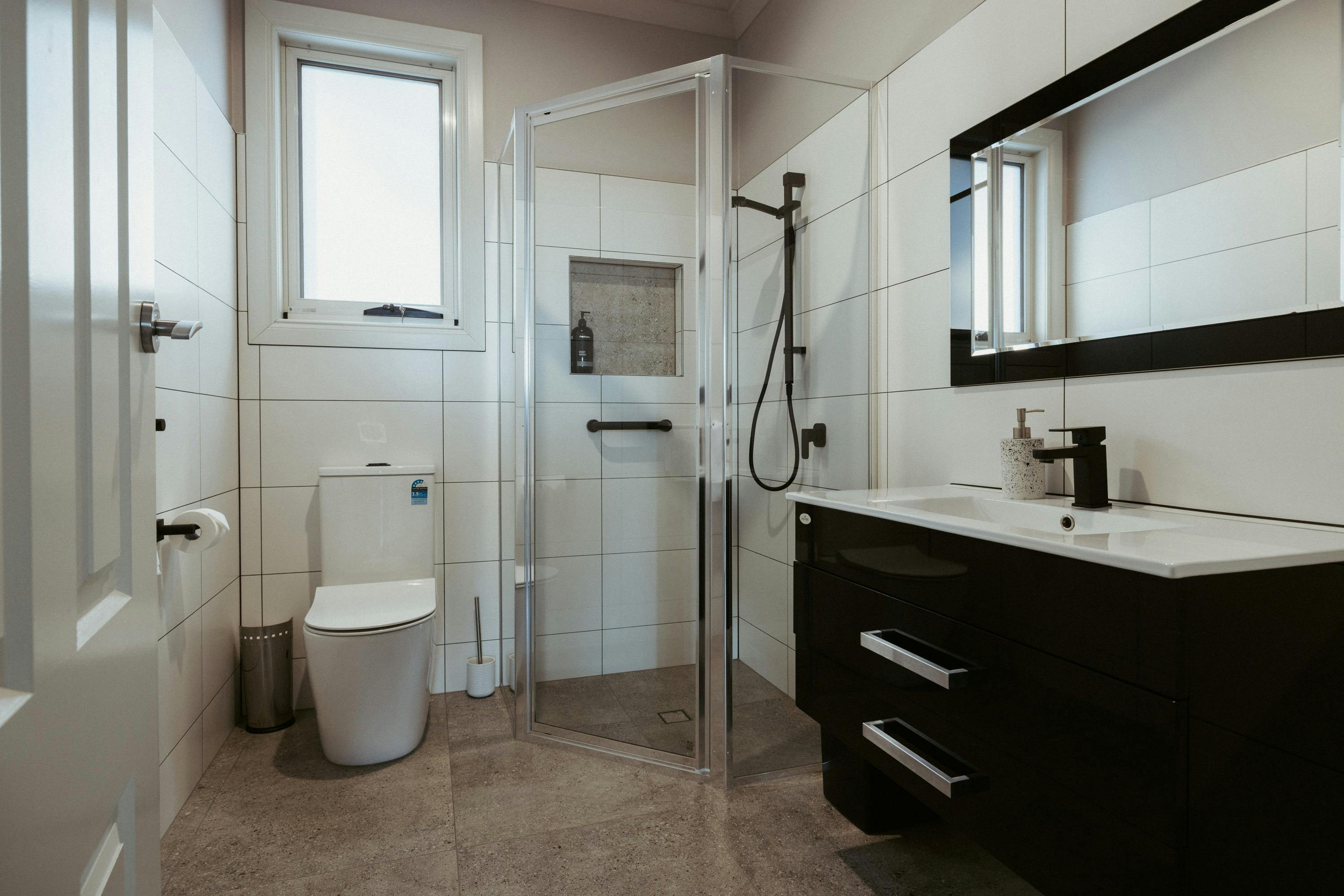 The modern bathroom is designed with your comfort in mind, featuring sleek, contemporary fixtures.