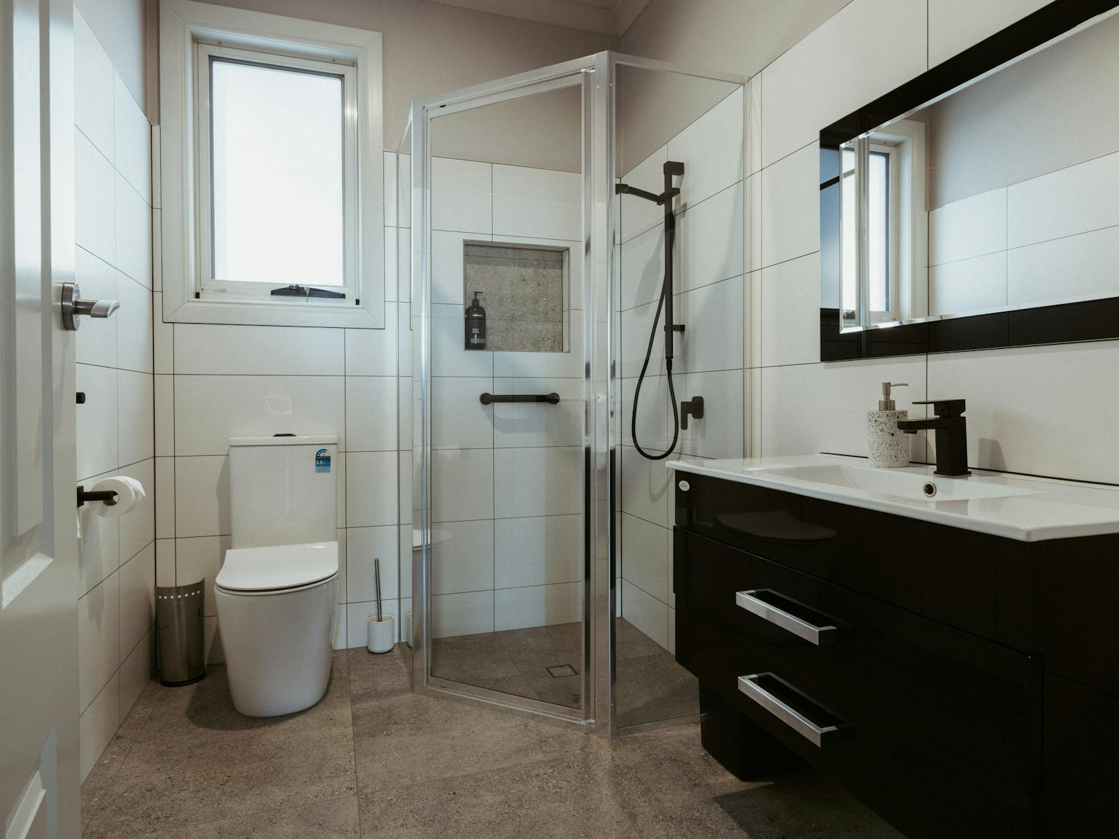 The modern bathroom is designed with your comfort in mind, featuring sleek, contemporary fixtures.