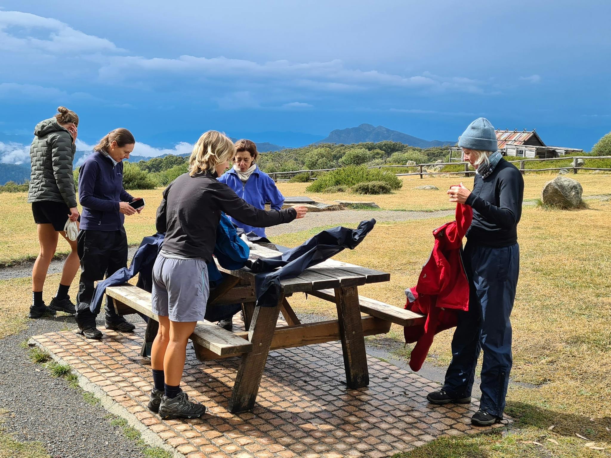 Hikers arrive at Craig's Hut.