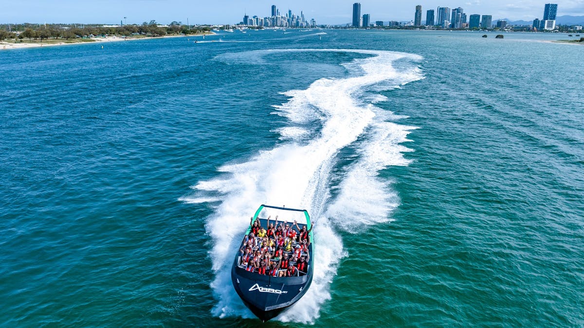 Aerial view of Arro Jet Boat with buildings in the background.