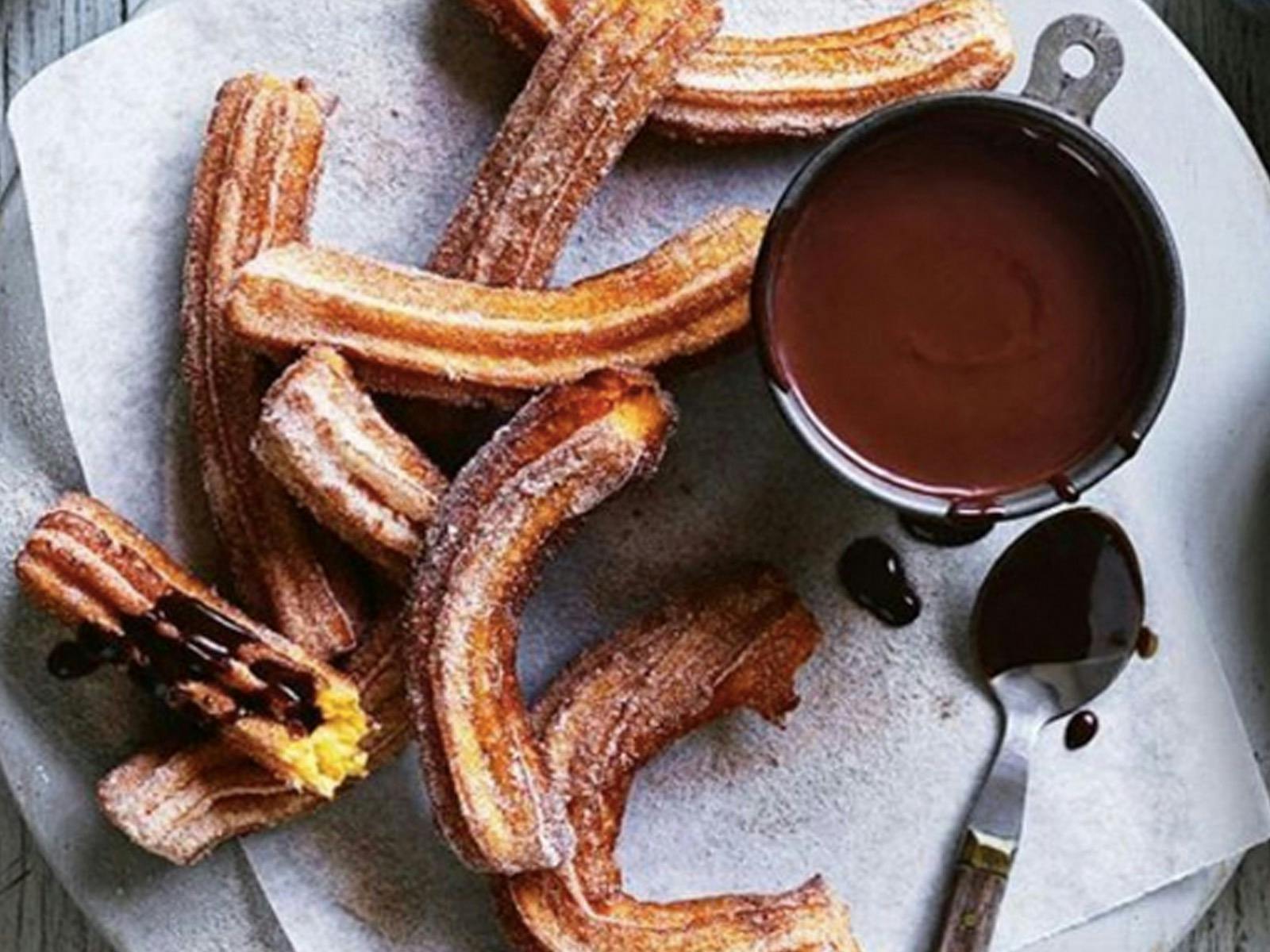 Handmade churros served w/ our Saludos Hot chocolate