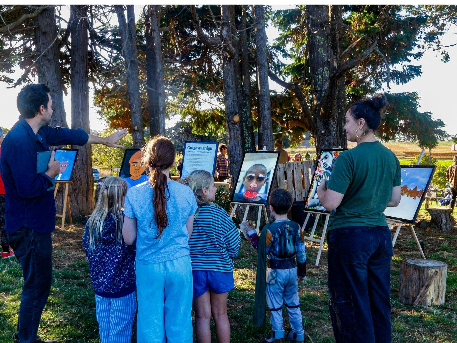 young people looking at digital artworks