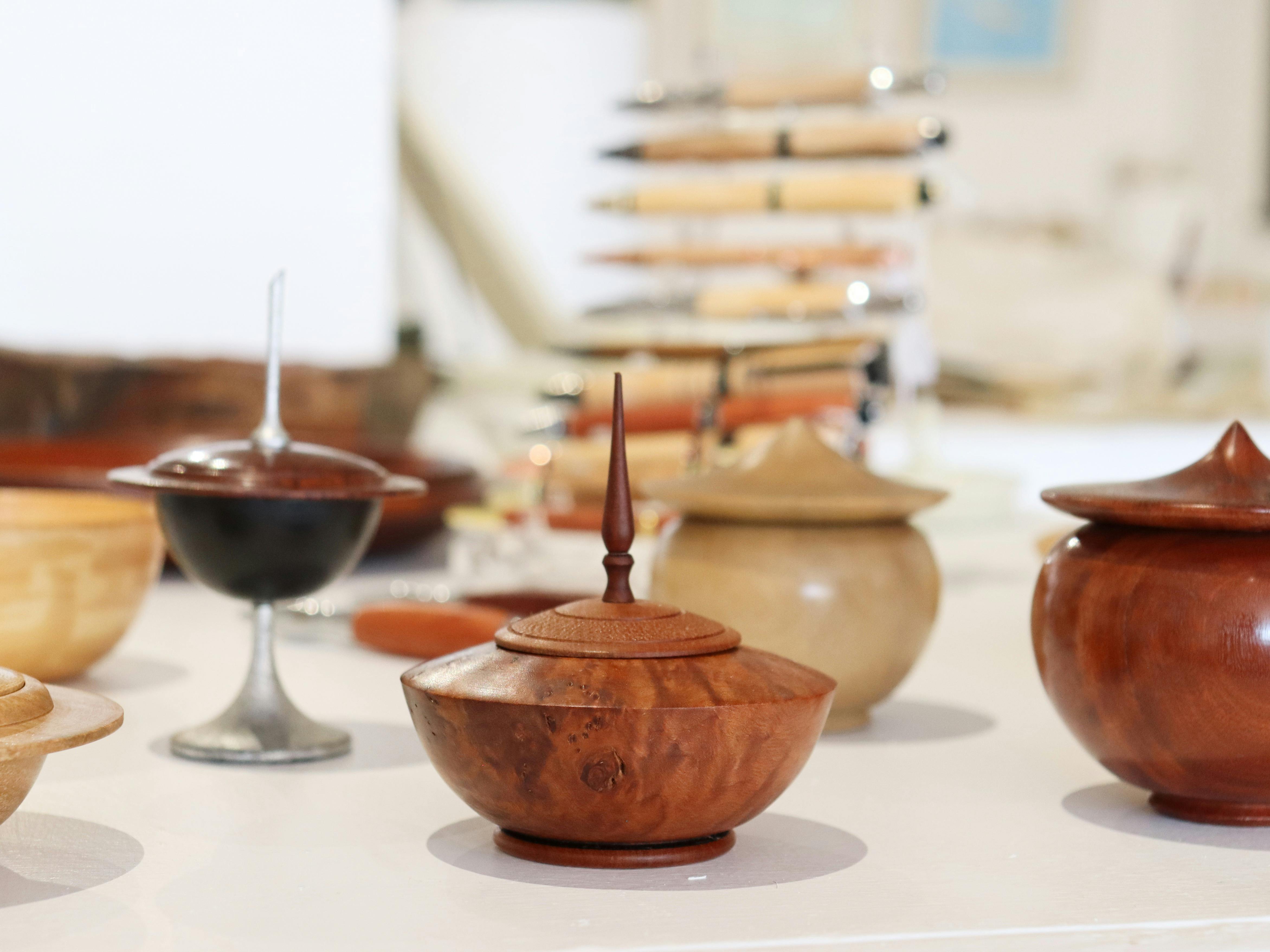 Wood Turned vessels and pens as part of Buttlejorrk