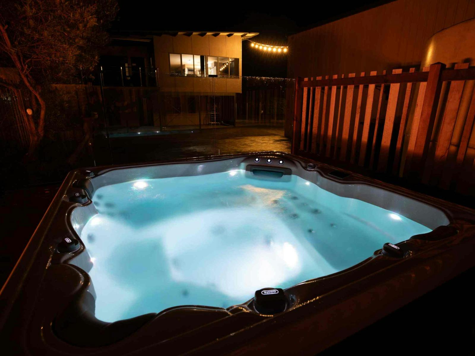 Heated outdoor spa at Binalong Bay Beach House in Binalong Bay, Tasmania.