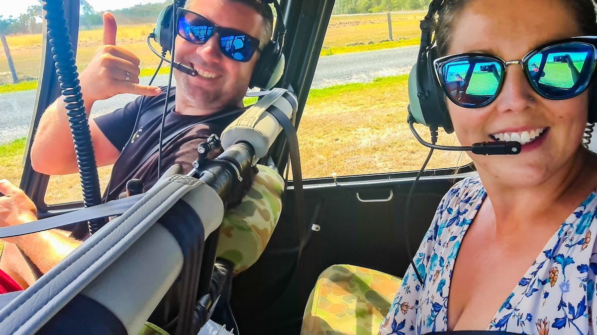 Photo of two passengers inside the helicopter about to take off