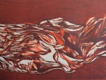 Section of a brown and orange woodcut print by artist Elaine Camlin