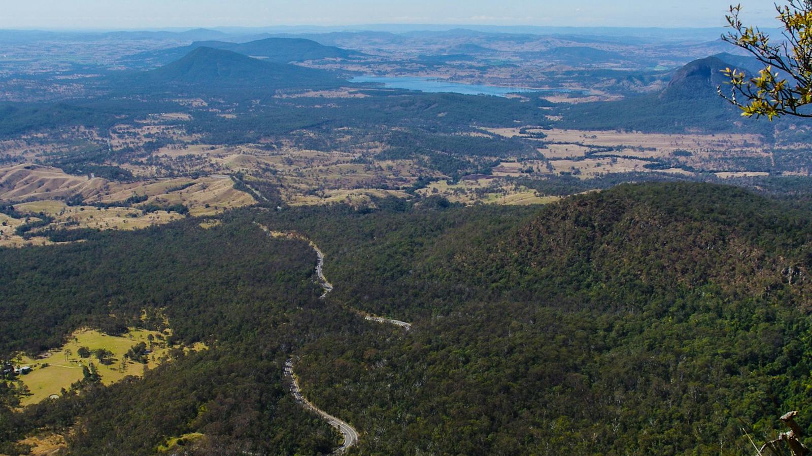 View of moutains, road, farmland and lake.