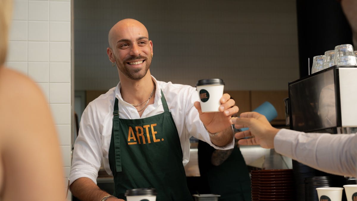 Barista serving coffee