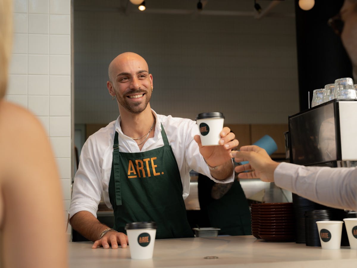 Barista serving coffee