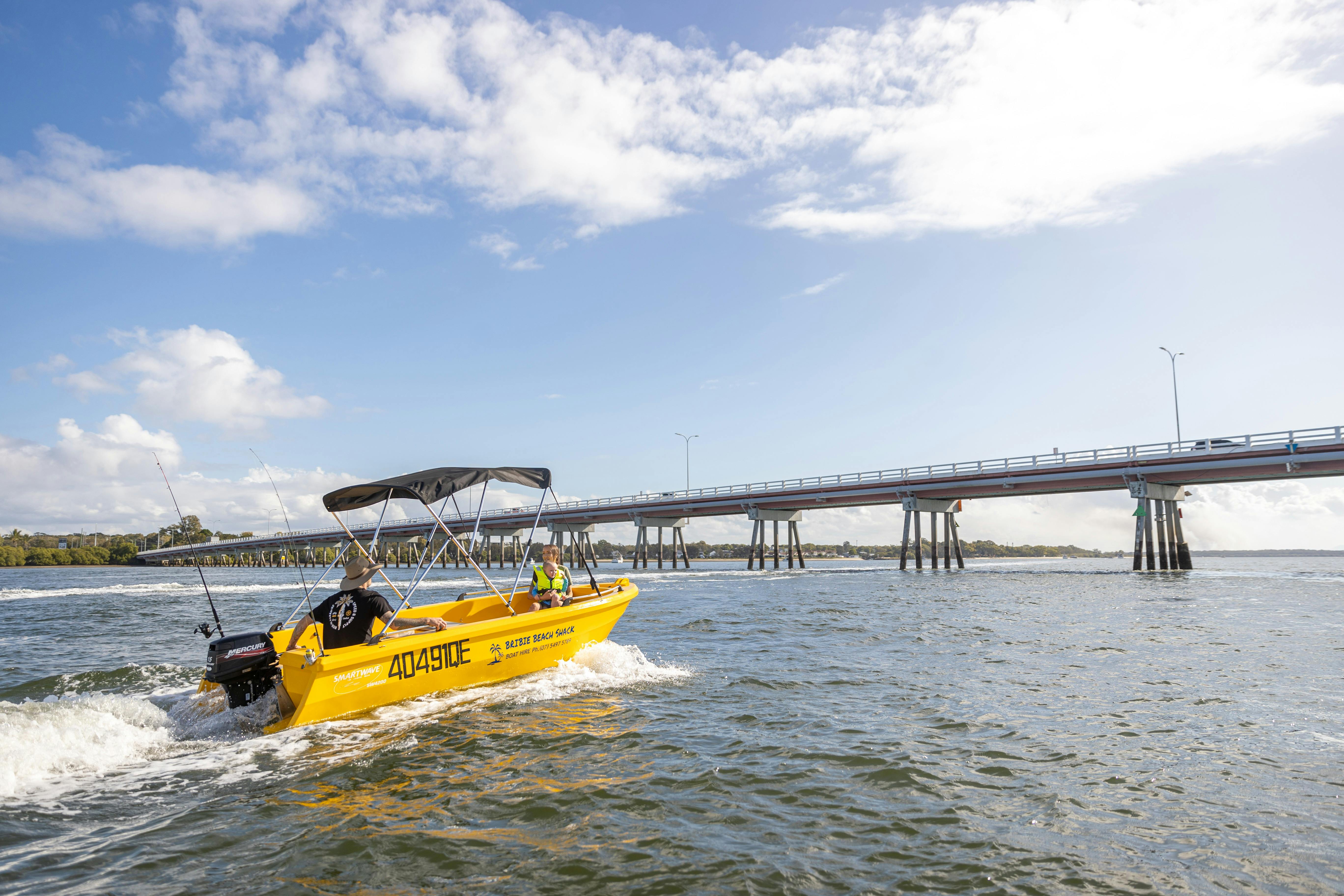 Bribie Beach Shack cruising boat with Bribie bridge in background