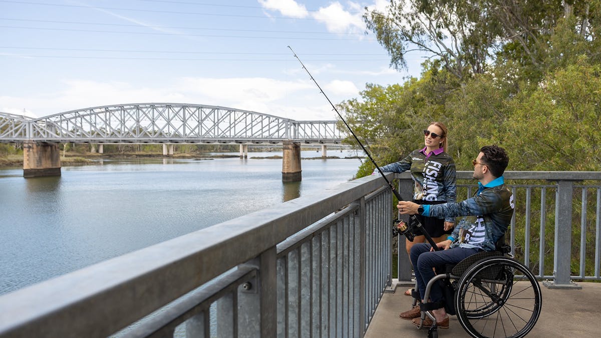 Young couple fishing from the Fitzroy River