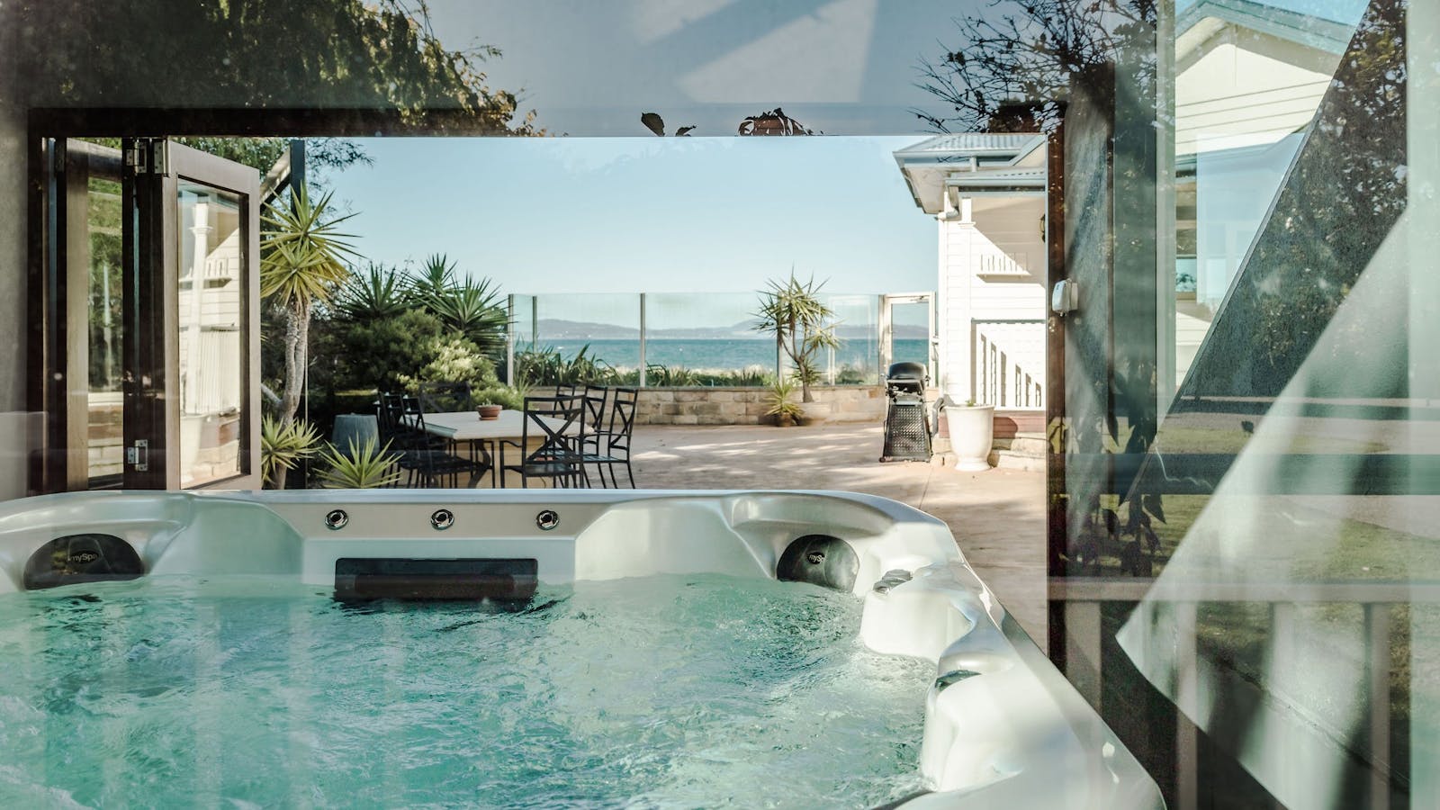 The hot tub with views out to the ocean