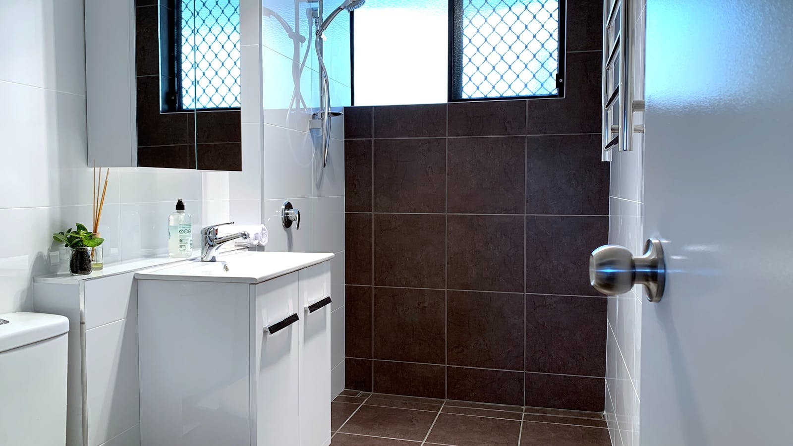 Full roll in shower in the bathroom. Washer & dryer