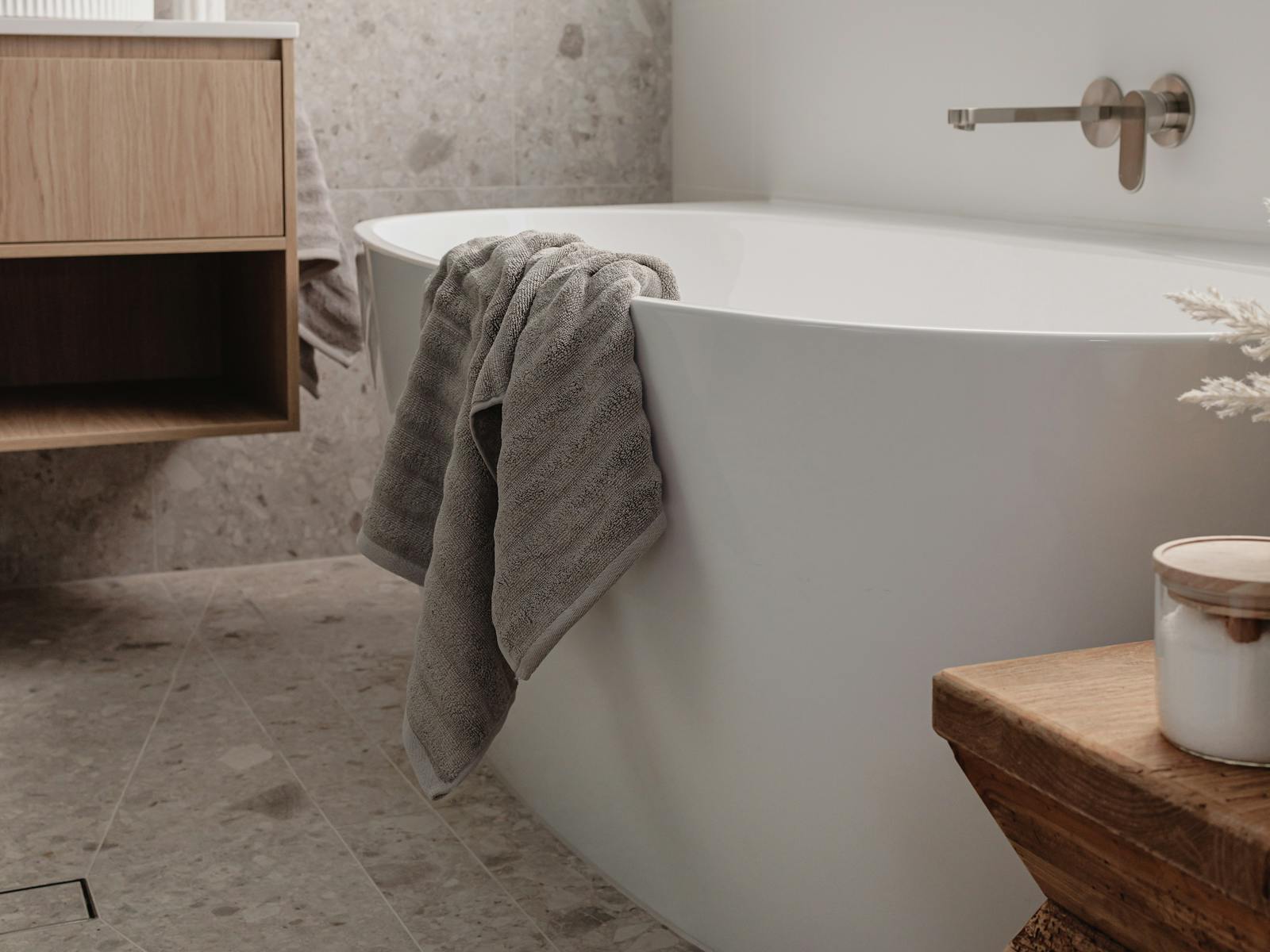 Luxe bathroom with terazzo tiles, high quality tapware and flooded with natural light
