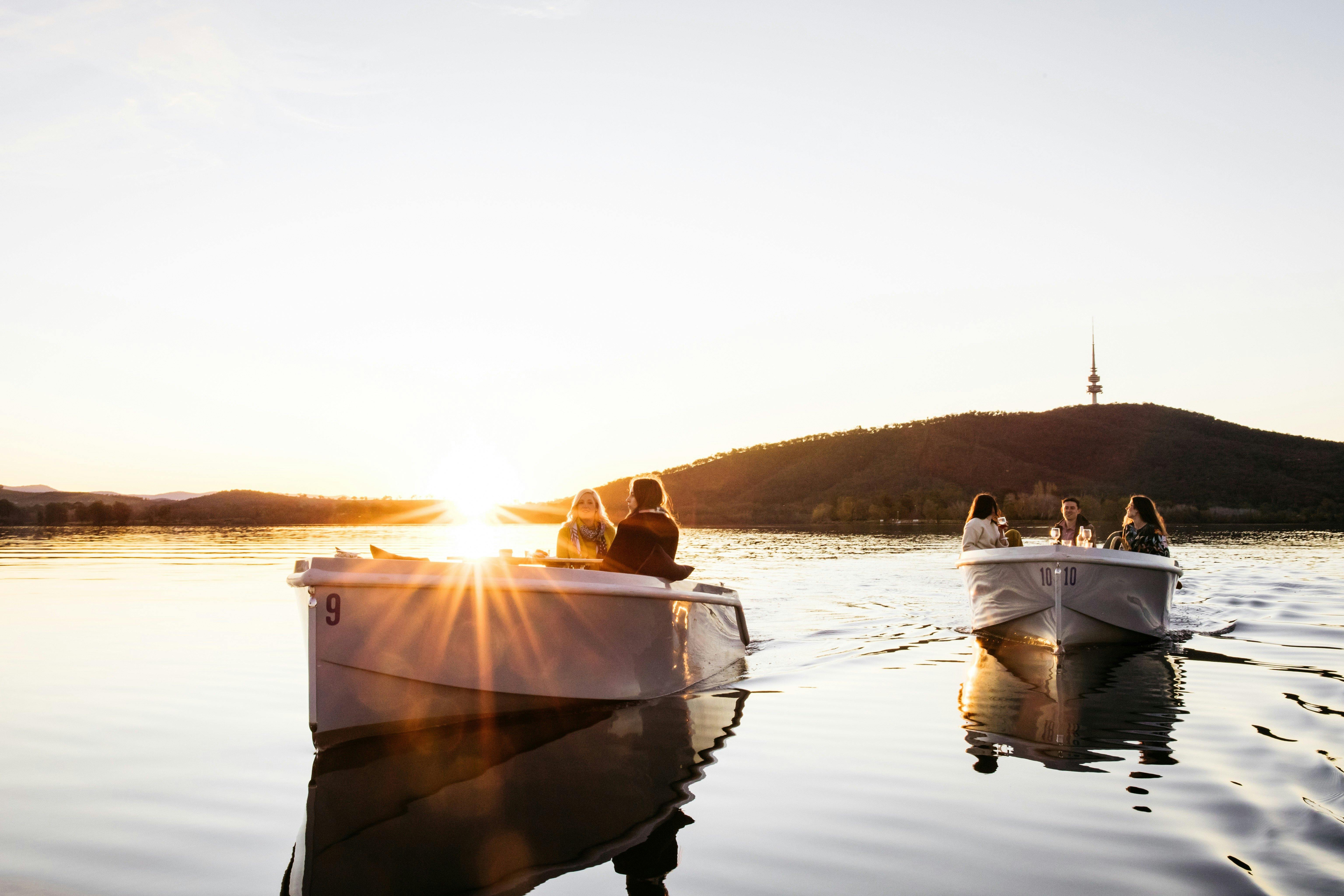 Two boats on the water at sunset