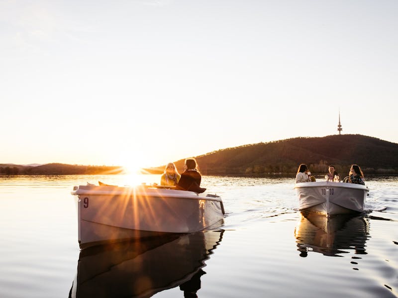 Two boats on the water at sunset
