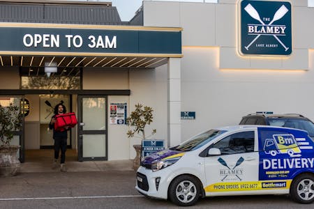 outside of the Blamey Hotel delivery car and services