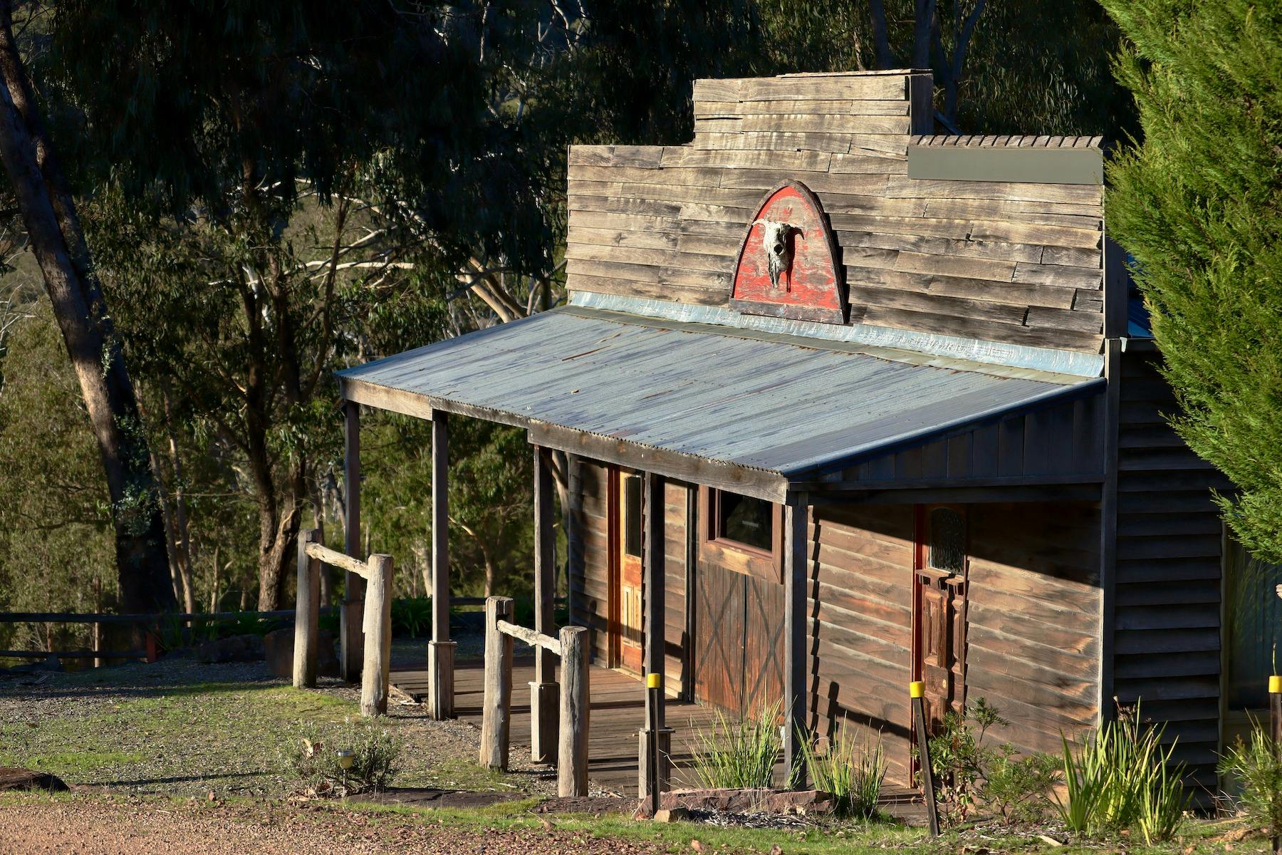 The Stables front facade, rustic saloon style with hitching posts