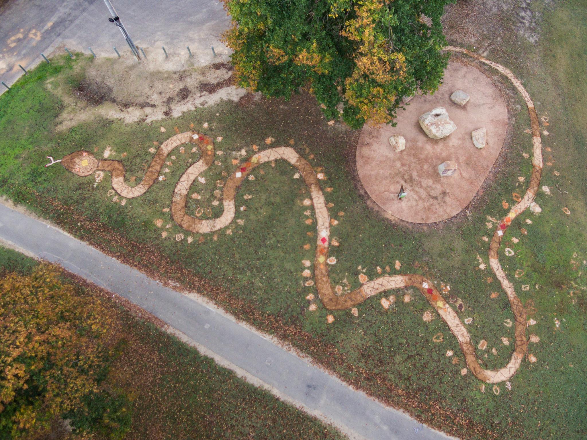 Aerial View of art project depicting a snake looping around Marmungan Rock