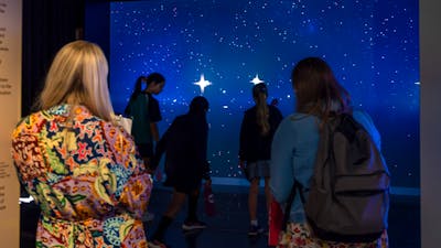 Young people interacting with Gravitational Weave at Outer Space
