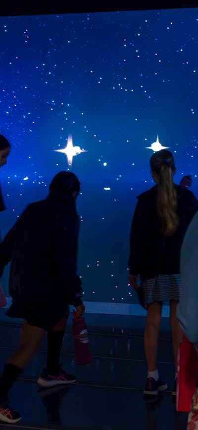 Young people interacting with Gravitational Weave at Outer Space