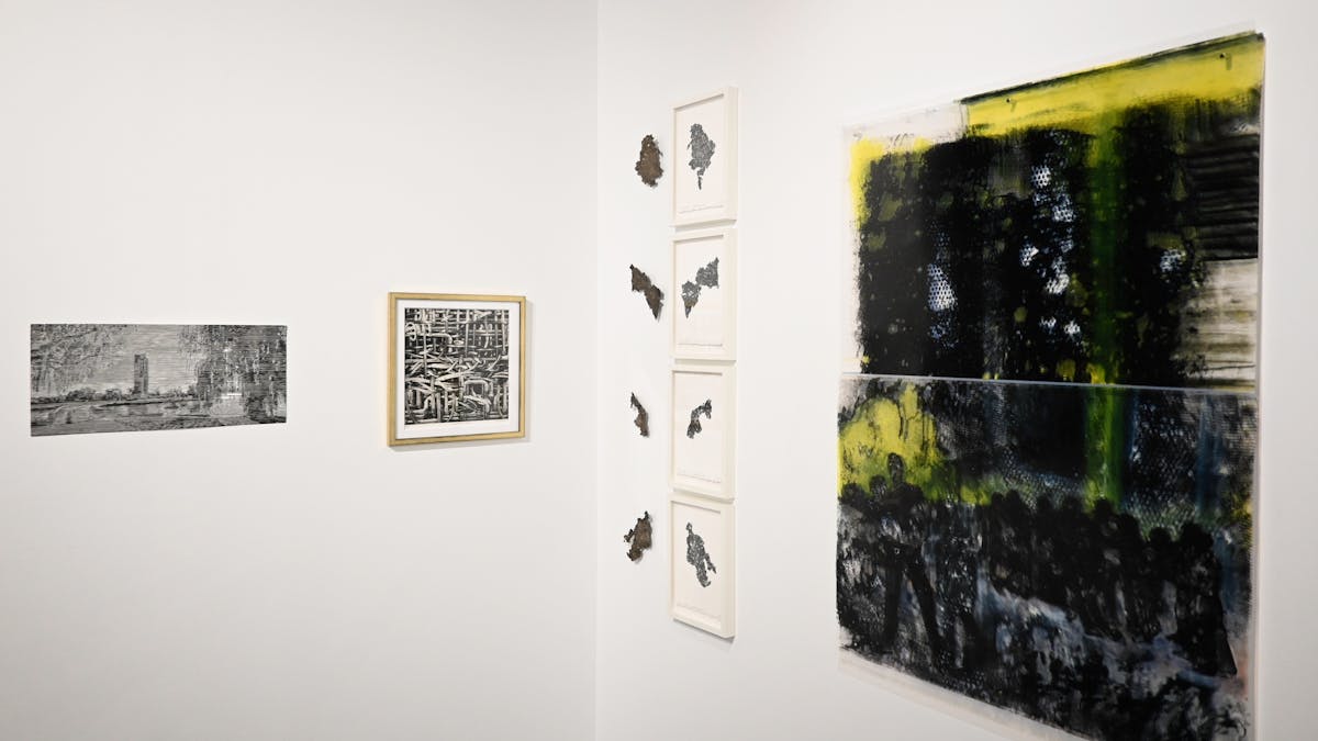 Four artworks displayed on the gallery wall