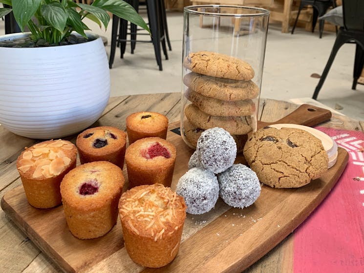 Friands, bliss balls and cookies displayed to show some of our gluten free and vegan options