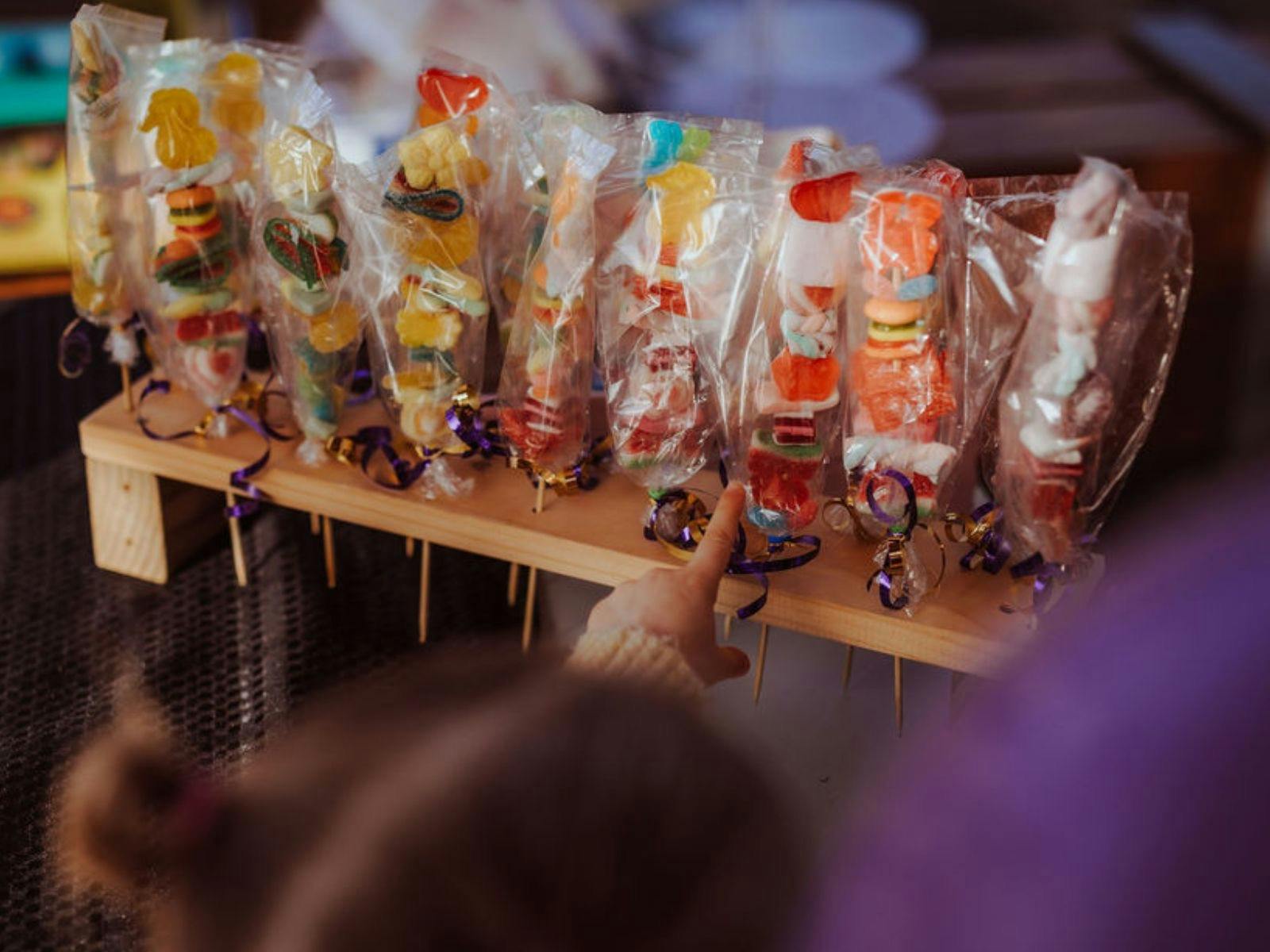 Child at sweet stand at the Strahan Market.