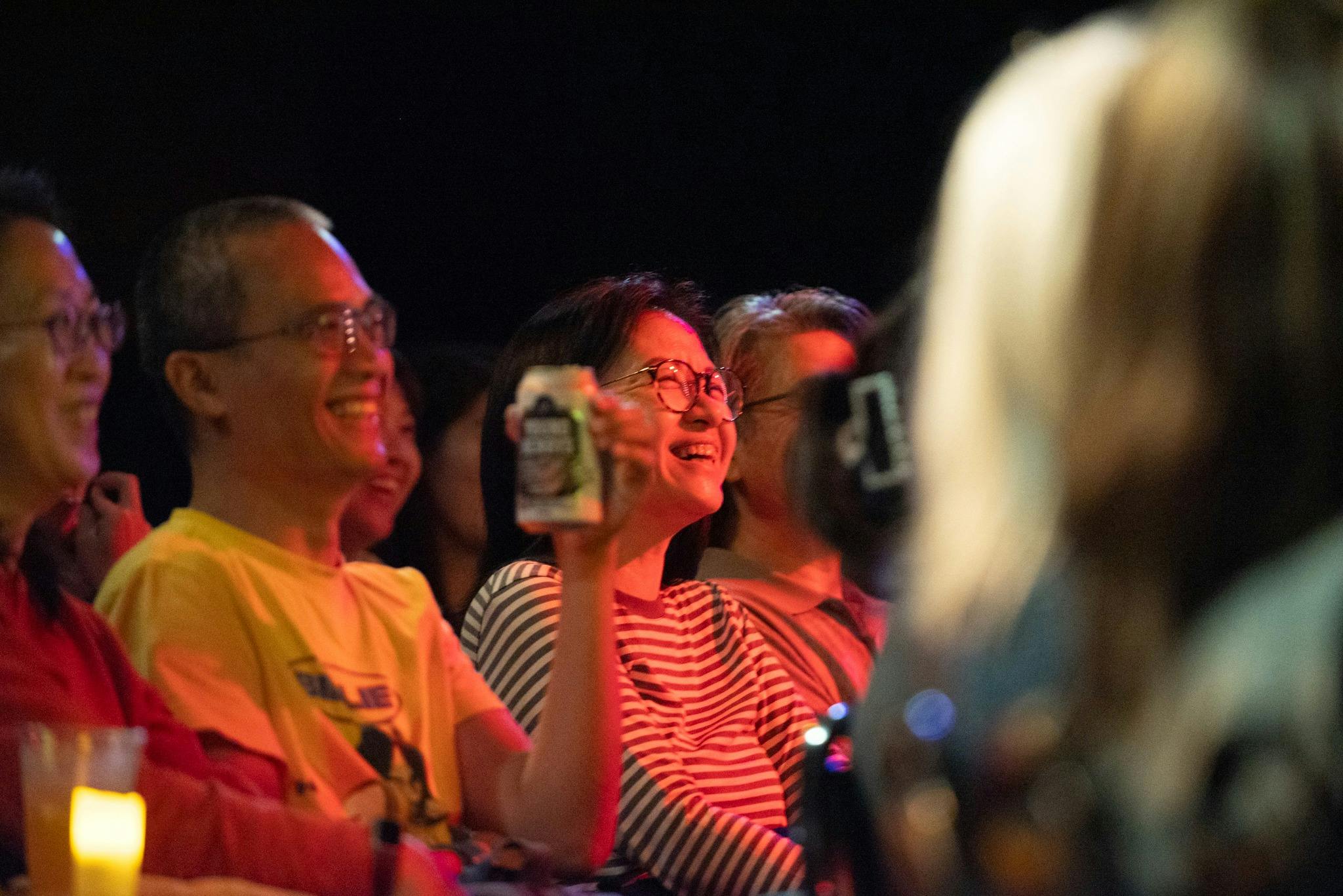 Guests enjoying a stand-up comedy show at The Comedy Store.