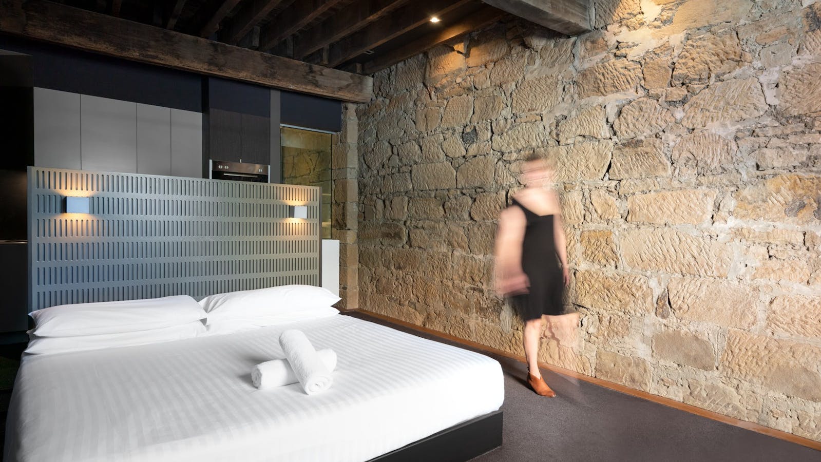 Warm sandstone walls and king bed comfort