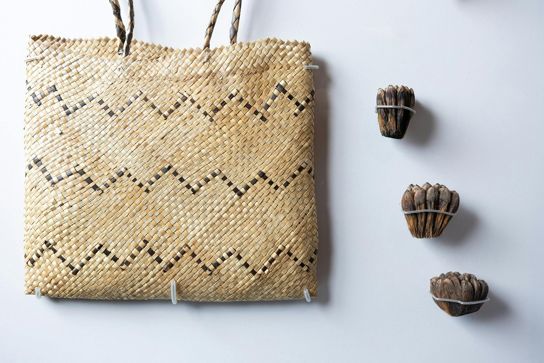 Basket woven from pandanus leaf fibre and pandanus seeds
