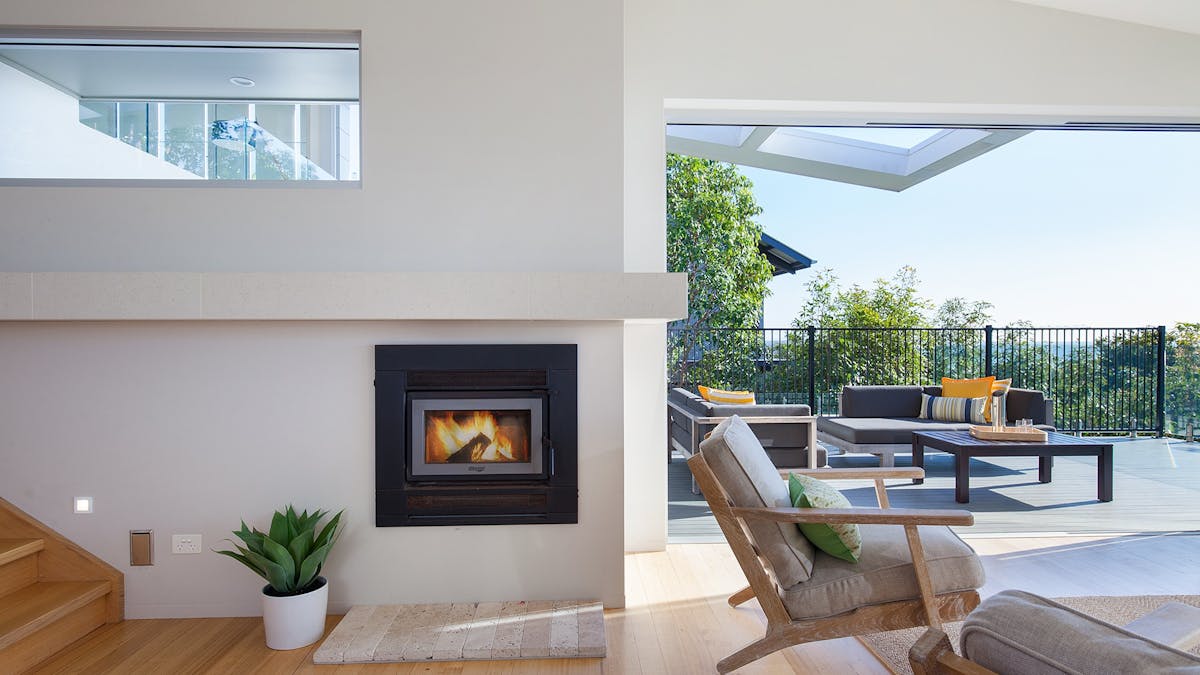Large open stacking doors leading out to pool and outdoor entertaining with ocean views