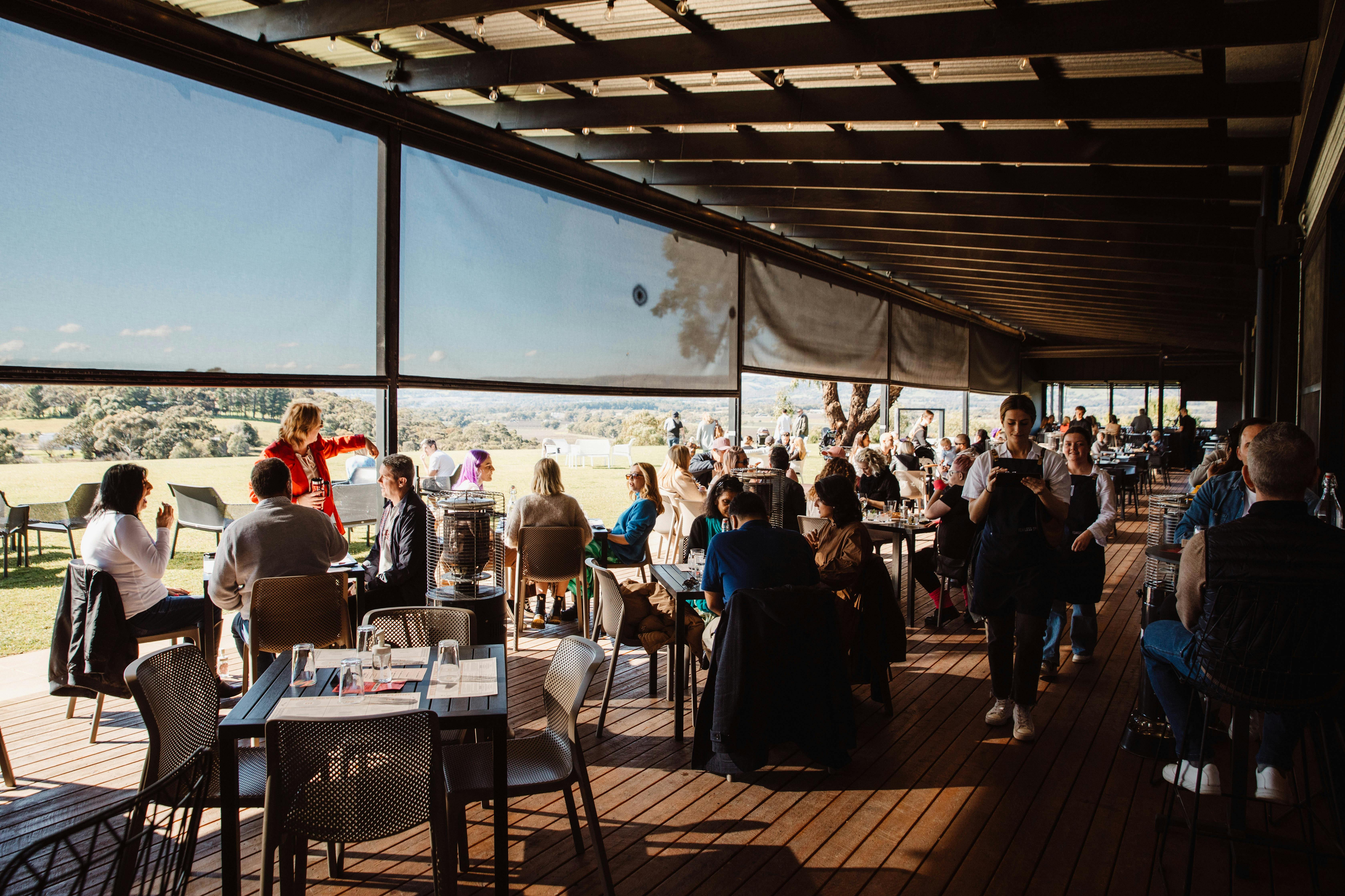 a busy sunday session with tables full of guests enjoying live music and delicious award winning gin