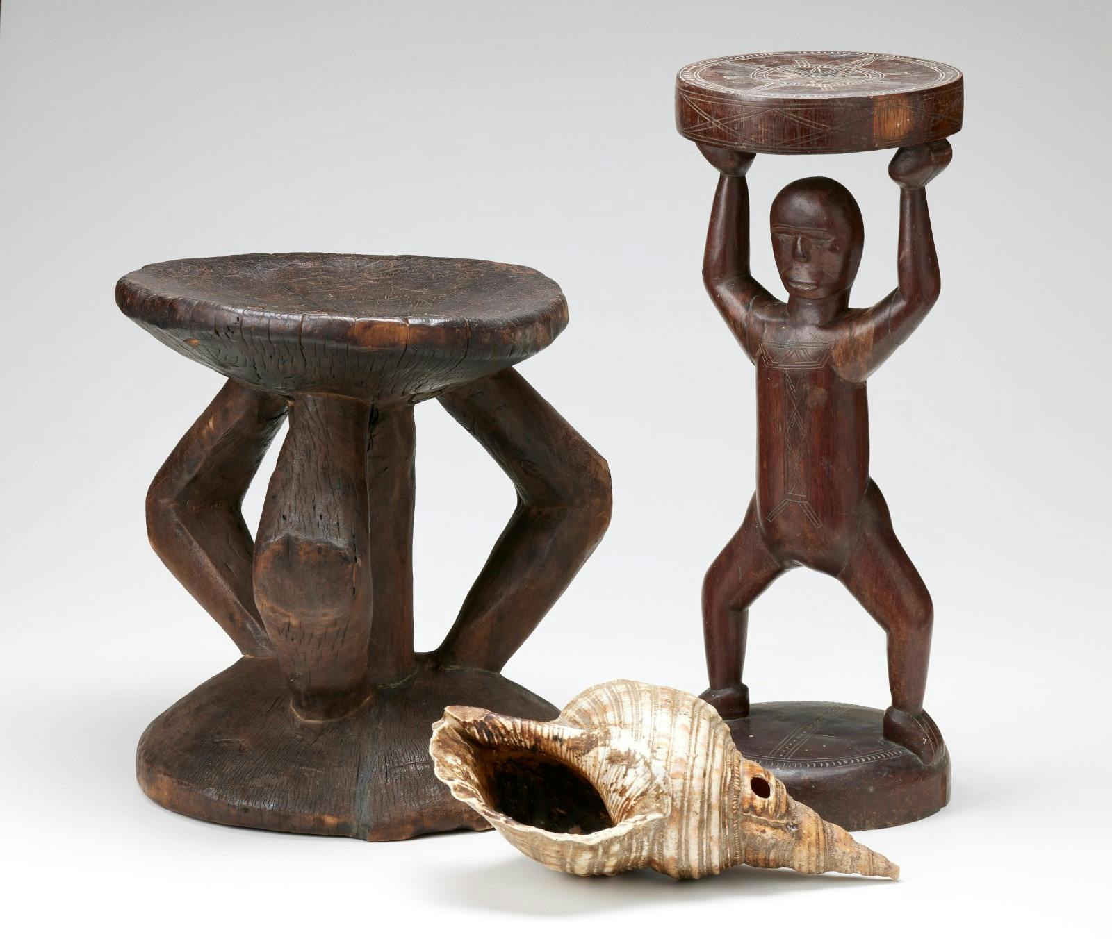 Stools and shell trumpet. Papua New Guinea.