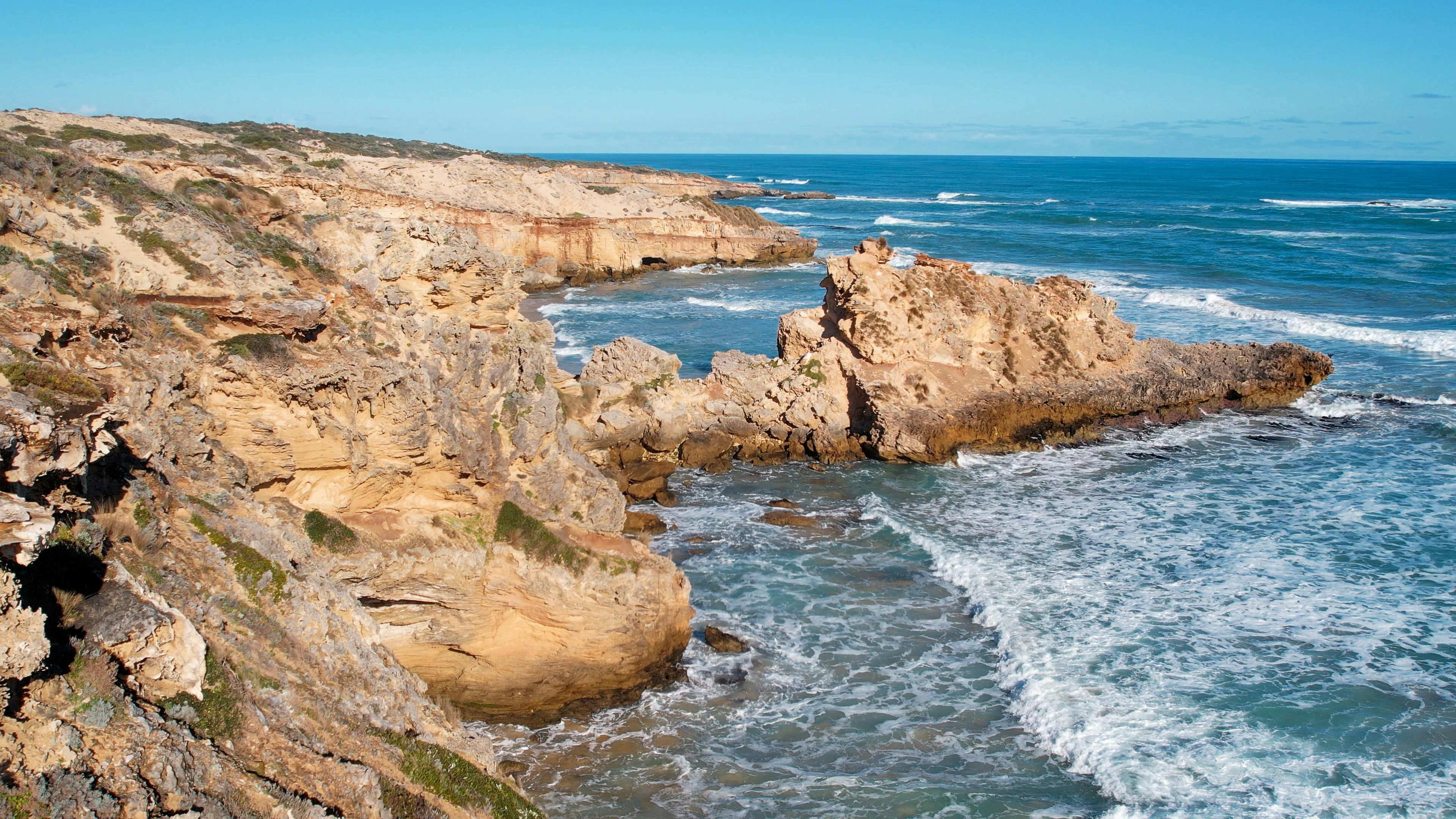 Landscape image of stunning Limestone Cliffs  high on the waters edge.