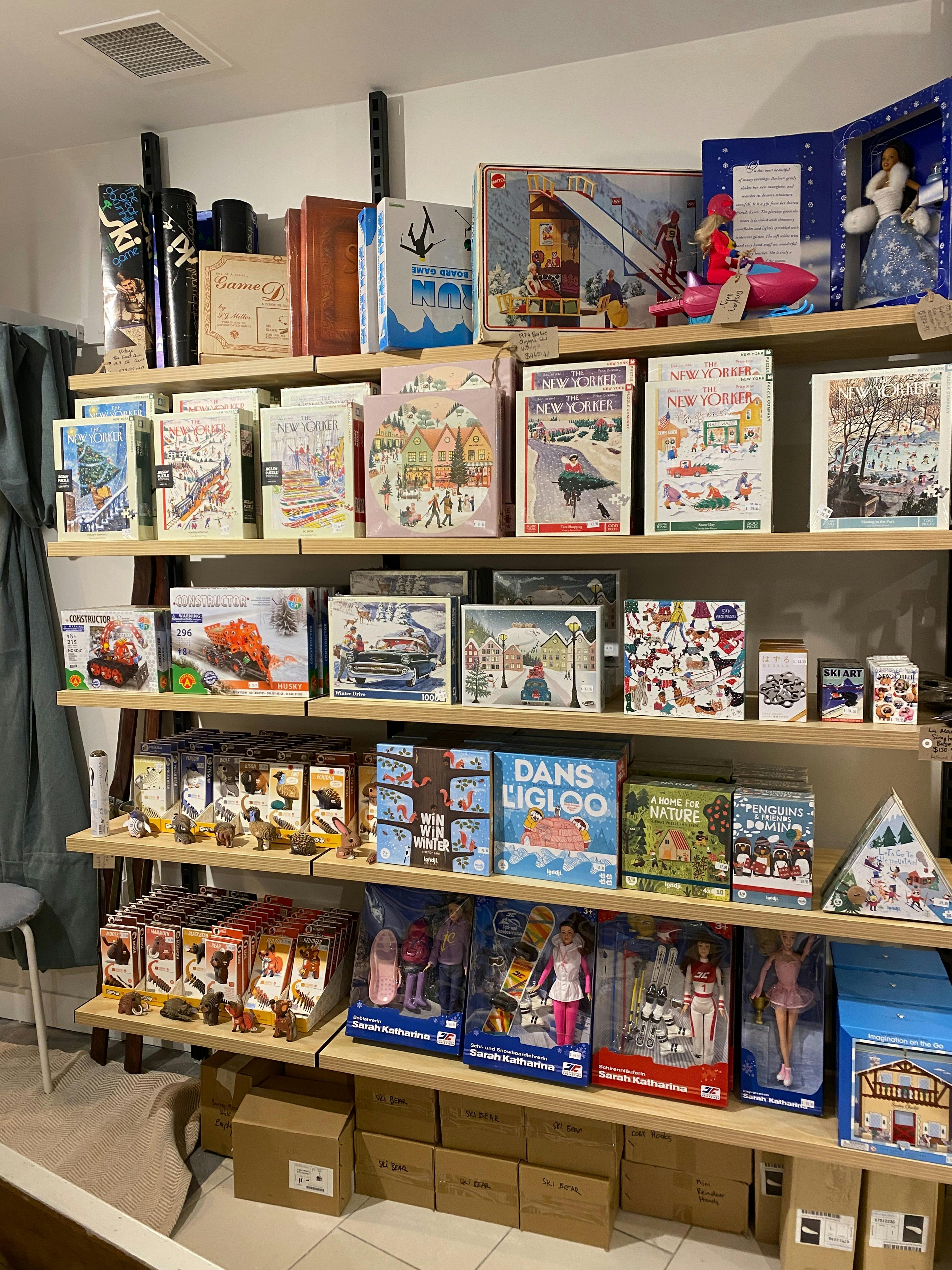 Photo shows shelves of puzzles, games and toys